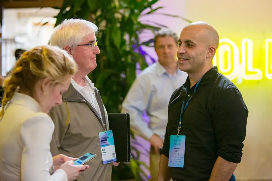 Attendees talking between sessions at the summit