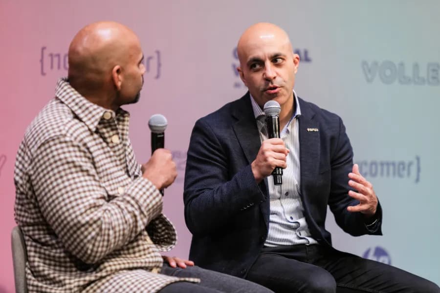 Two speakers in conversation on the CVAI2 stage