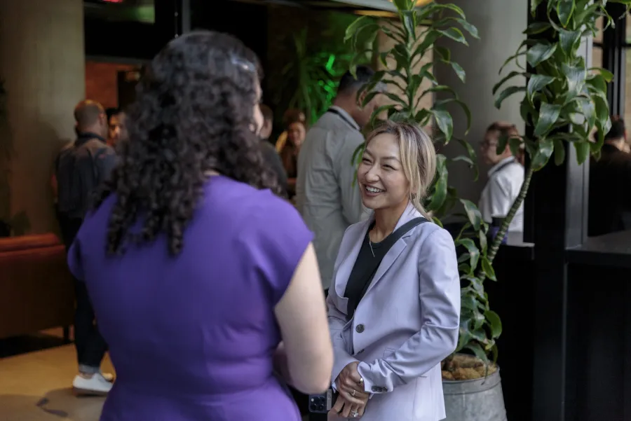 Attendees talking at the CVNY reception